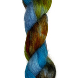 Skein of mohair silk yarn hand-dyed in Wyoming in the color blue green brown orange