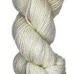 A handspun skein of angora merino yarn in a natural white color