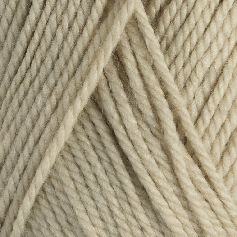 Close-up of beige yarn with a textured pattern