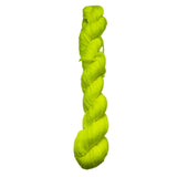 Braided neon green yarn on a white background
