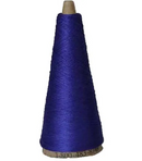 Blue spool of navy cotton on a white background