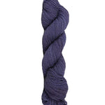 Blue skein of mountain meadow wool yarn on a white background