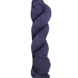 Blue skein of mountain meadow wool yarn on a white background