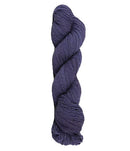 Blue skein of mountain meadow wool yarn on a white background