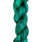 A skein of hand-dyed fingering/sock yarn color green black 