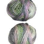 Two balls of multicolored yarn on a white background