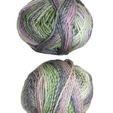 Two balls of multicolored yarn on a white background