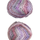Two skeins of multicolored yarn on a white surface