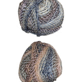 Two skeins of multicolored yarn on a white surface