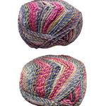 Two skeins of multicolored yarn on a white surface