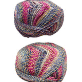 Two skeins of multicolored yarn on a white surface