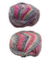 Two skeins of multicolored yarn on a white surface