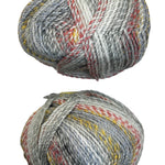 A variegated skein of yarn in the colors white grey red orange yellow black