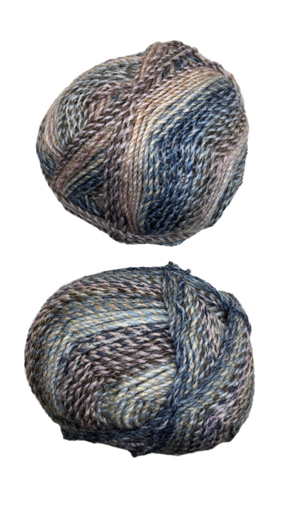 A variegated skein of yarn in the colors mauve white blue black grey navy