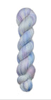 A skein of hand-dyed fingering/sock yarn color white pastel pink purple blue 