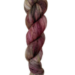 A skein of hand-dyed fingering/sock yarn color brown tan red speckles