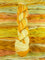Skein of multicolored handspun looking wool yarn in the colors yellow white orange 