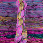Skein of multicolored handspun looking wool yarn in the colors pink teal yellow burgundy purple 