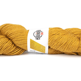 Mustard yellow skein of yarn with a label on a white background