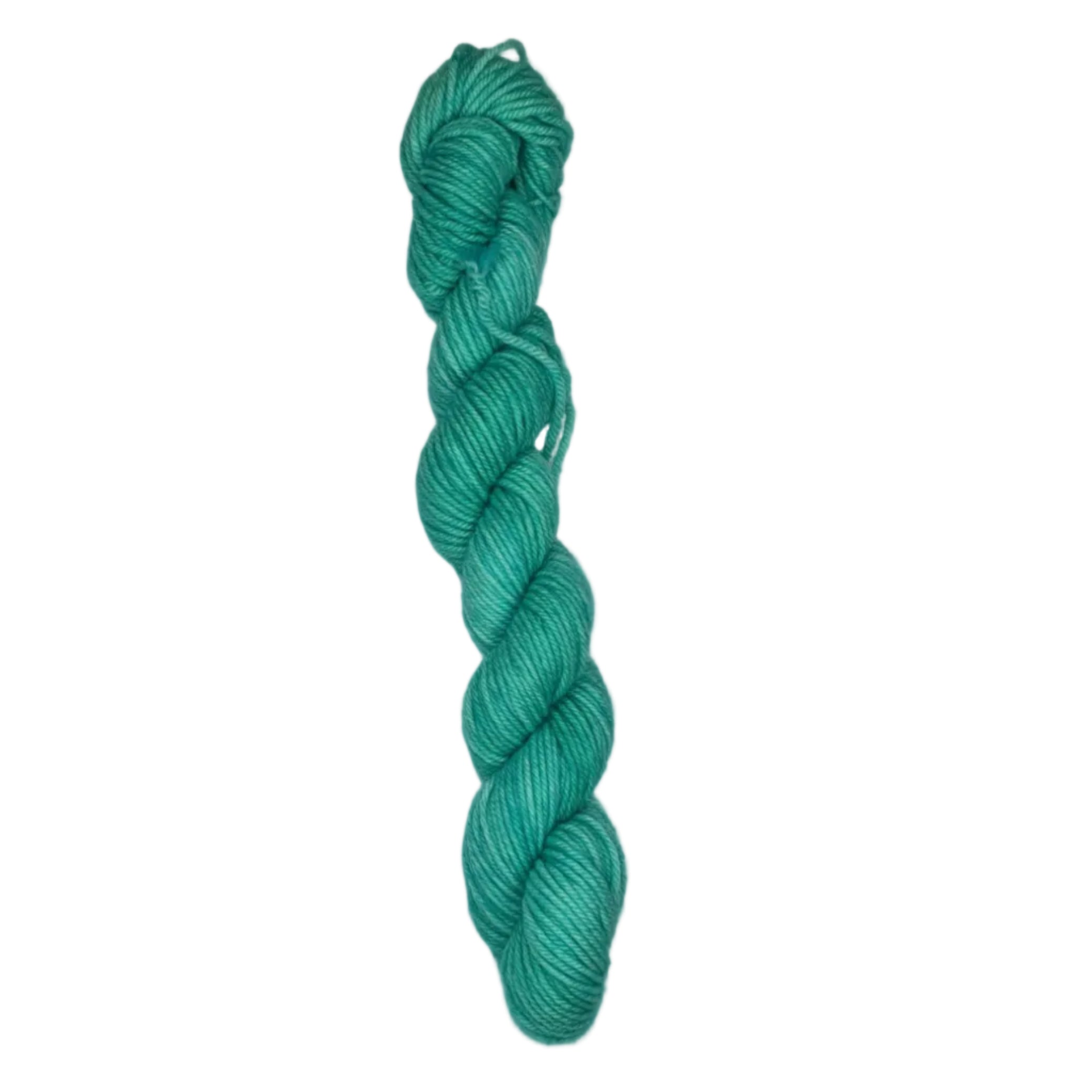 A skein of turquoise yarn on a white background 