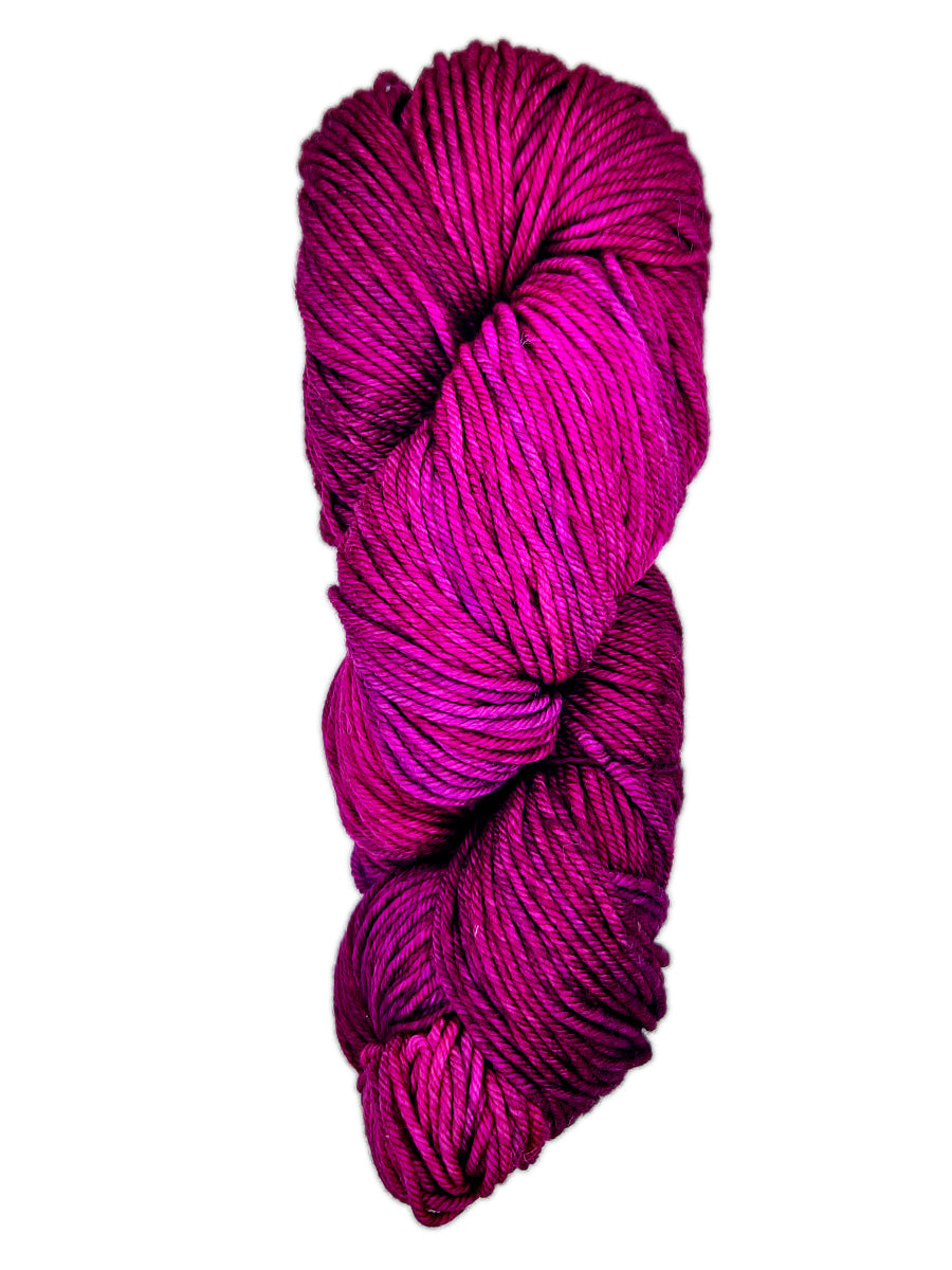 A hank of magenta yarn by Malabrigo Rios yarn