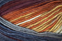Detailed image of Universal Yarn Maman Acrylic Yarn in the colors  off-white, orange, red, navy, grey