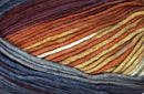 Detailed image of Universal Yarn Maman Acrylic Yarn in the colors  off-white, orange, red, navy, grey