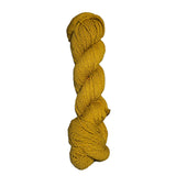 Yellow skein of mountain meadow wool yarn on a white background