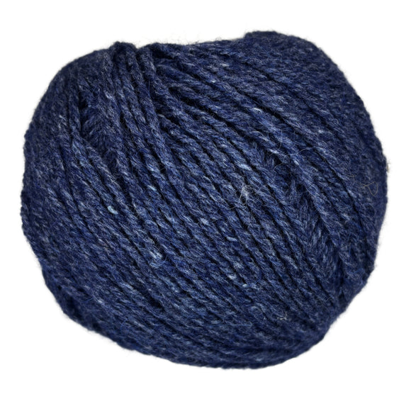 Ball of mildly tweedy yarn color midnight blue