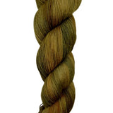 A skein of hand-dyed fingering/sock yarn color brown tan black
