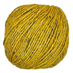 Ball of mildly tweedy yarn color Mustard