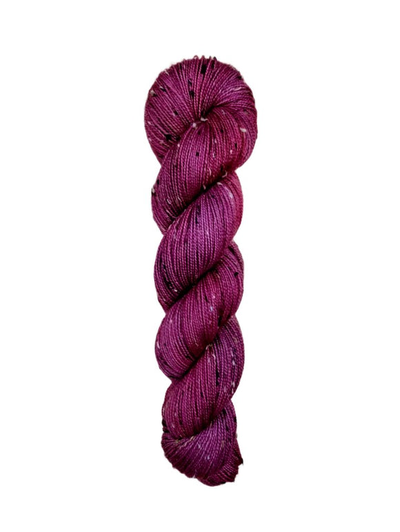 Skein of hand dyed BFL Tweed Yarn color wine red