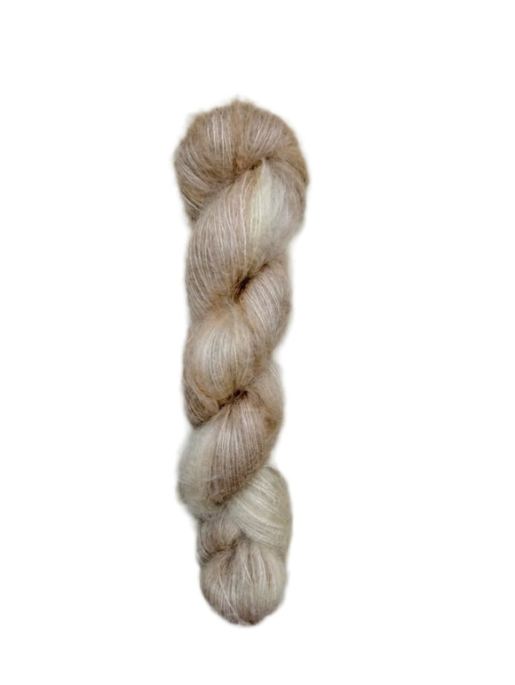 Skein of superkid mohair silk lace weight yarn color off white