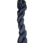 Dark blue skein of wool yarn on a white background