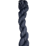 Dark blue skein of wool yarn on a white background