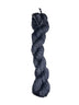 Dark blue skein of wool yarn on a white background