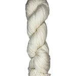 Natural skein of mountain meadow wool yarn on a white background