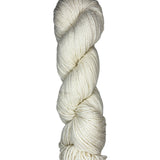 Natural skein of mountain meadow wool yarn on a white background