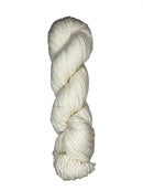 Natural skein of mountain meadow wool yarn on a white background