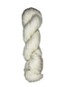 Natural skein of mountain meadow wool yarn on a white background