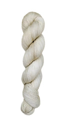A skein of hand-dyed fingering/sock yarn color off-white grey