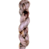 Skein of superkid mohair silk lace weight yarn color brown pink