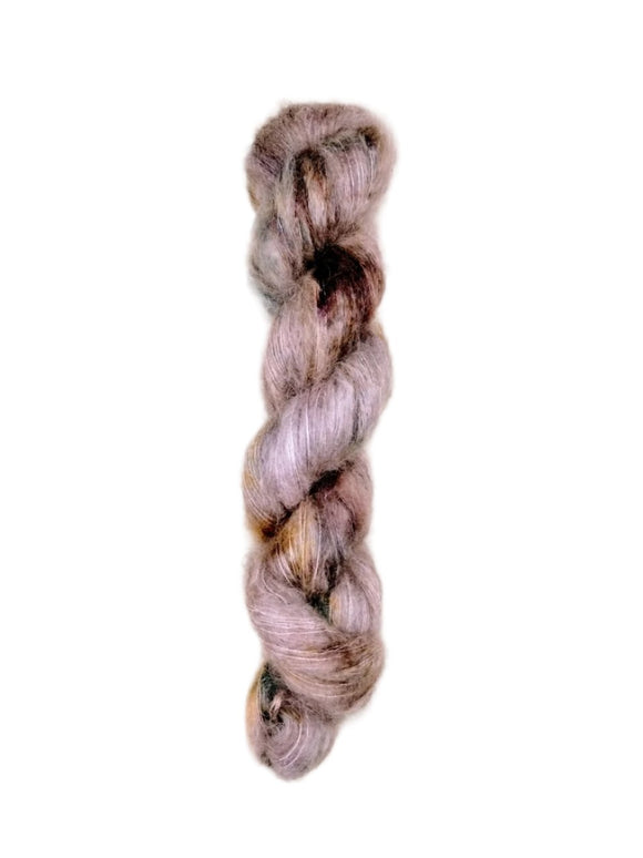 Skein of superkid mohair silk lace weight yarn color brown pink