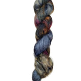 Skein of superkid mohair silk lace weight yarn color blue brown red black