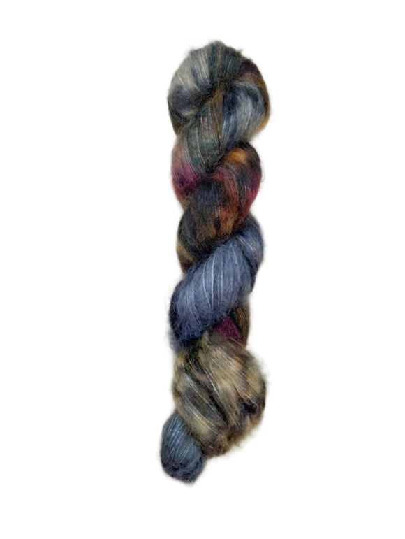 Skein of superkid mohair silk lace weight yarn color blue brown red black