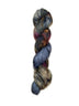 Skein of superkid mohair silk lace weight yarn color blue brown red black