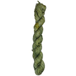 A skein of green yarn on a white background