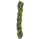 A skein of green yarn on a white background