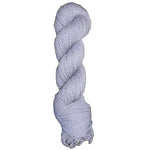 Light blue / purple skein of mountain meadow wool yarn on a white background