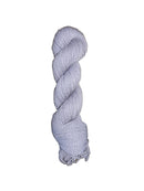 Light blue / purple skein of mountain meadow wool yarn on a white background